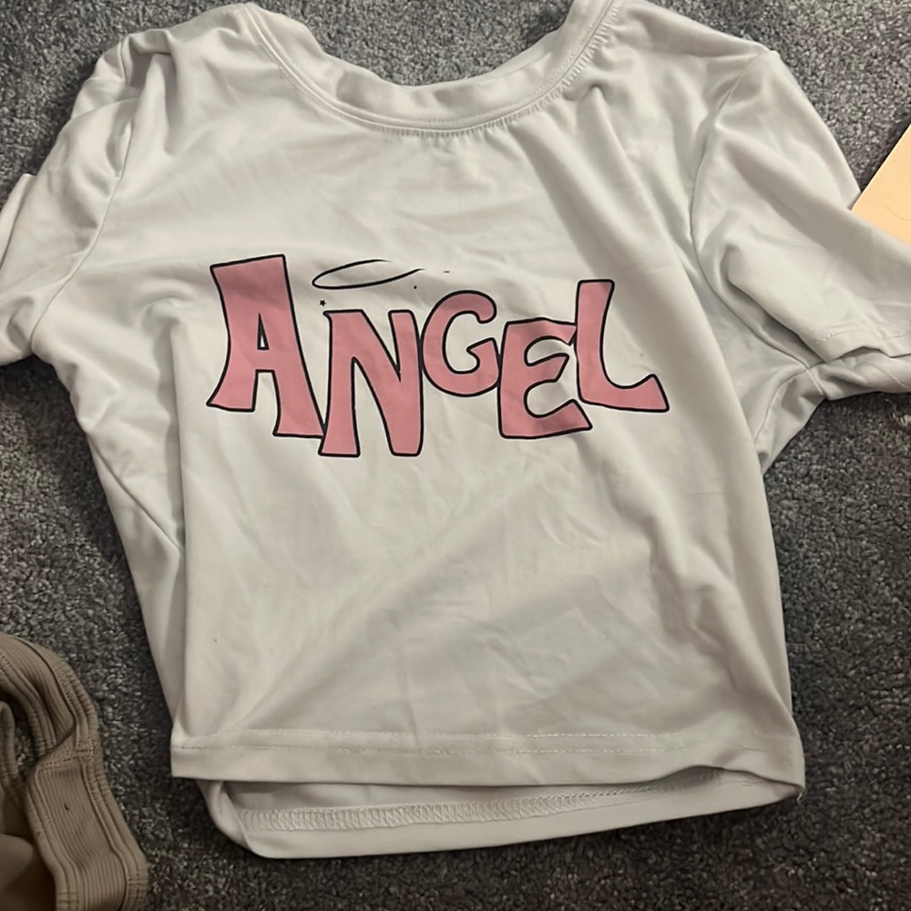 white and pink angel shirt